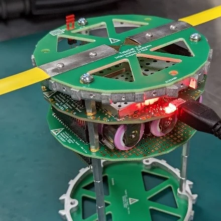 The BobcatOrbiter TubeSat in its cylindrical chassis.
